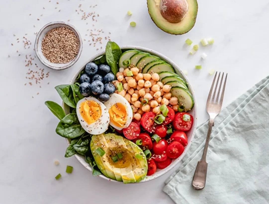 Healthy bowl with avocado, eggs, chickpeas and vegetables